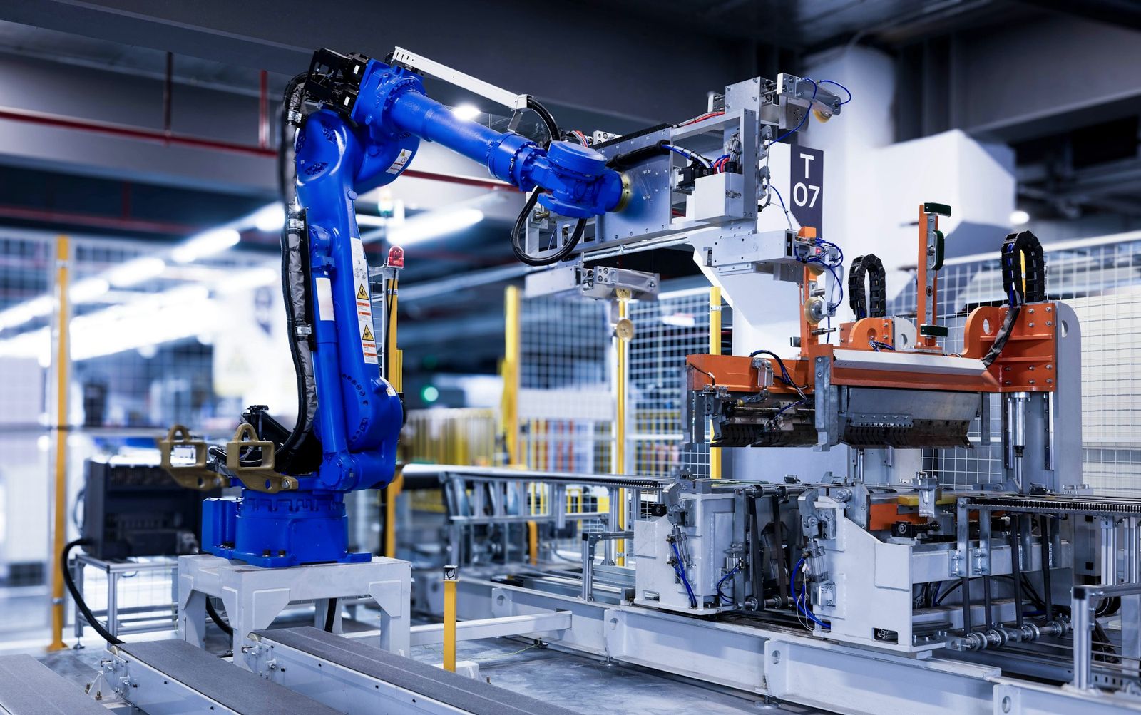 An industrial robot arm working on an automated production line