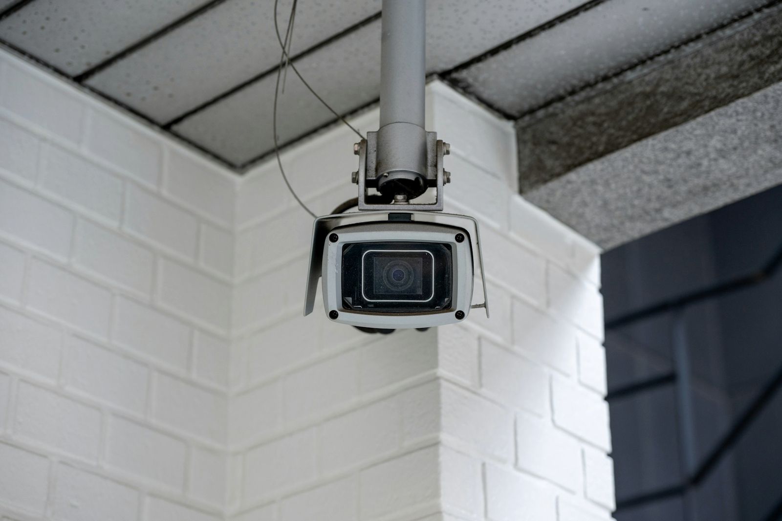 A security camera mounted on the corner of a building